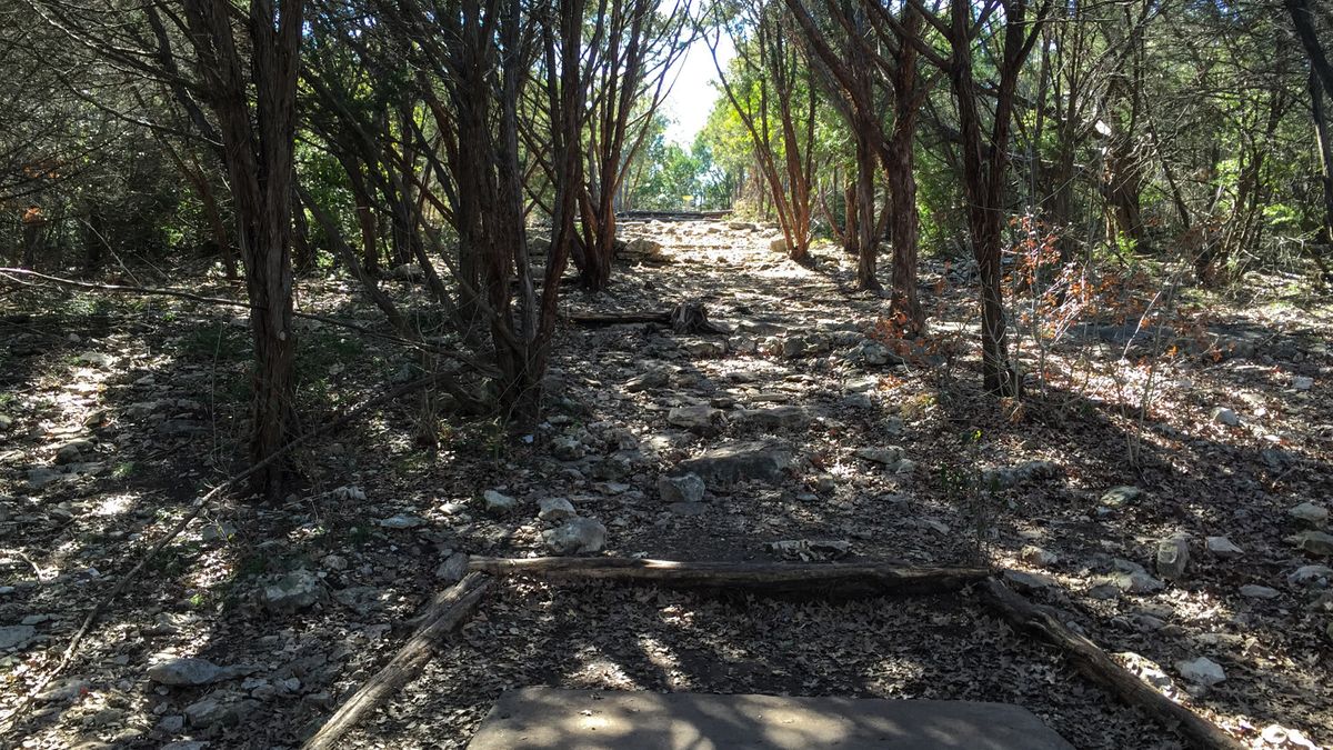 Hole 9 Tee box. About a 30-40 foot climb to the top. Play it longer then the sign footage says.