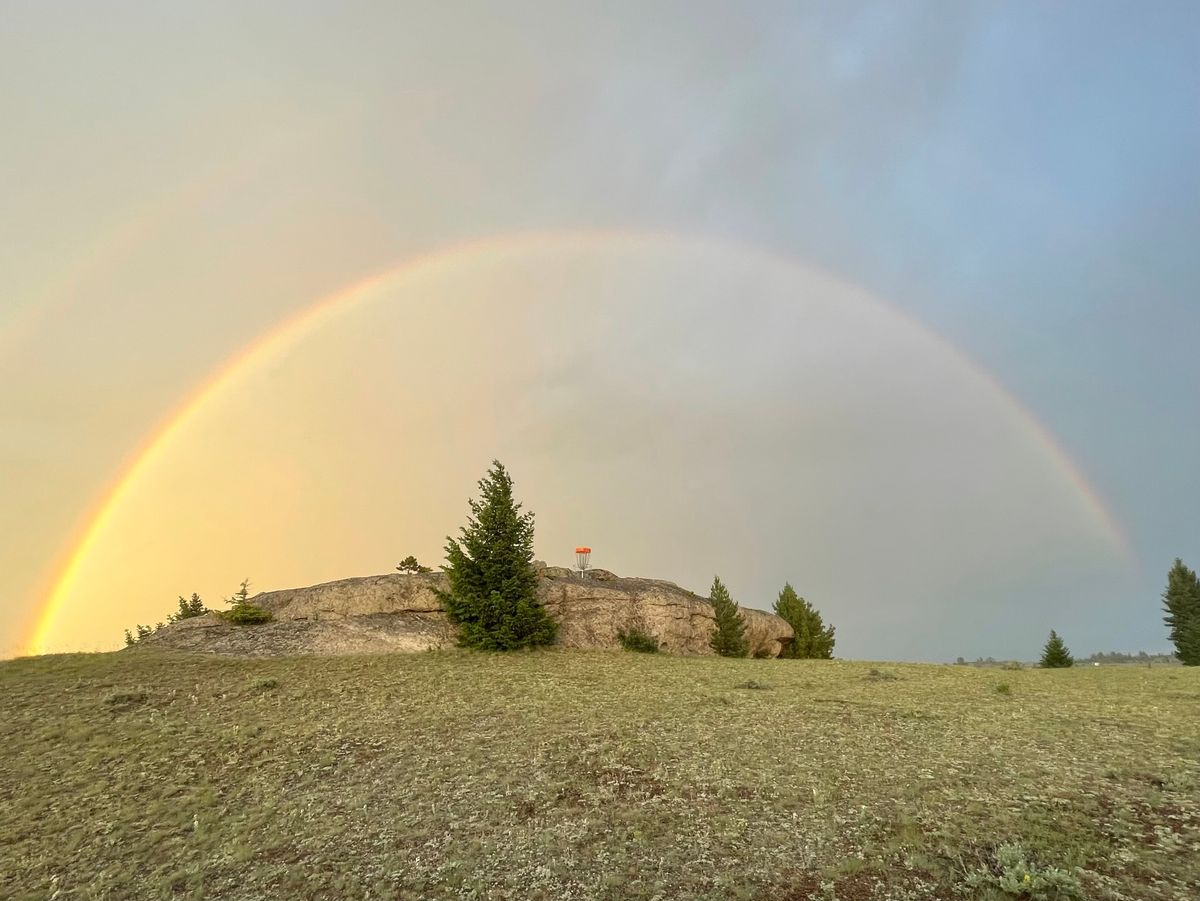 Rainbow over green of hole #10 - West Course.