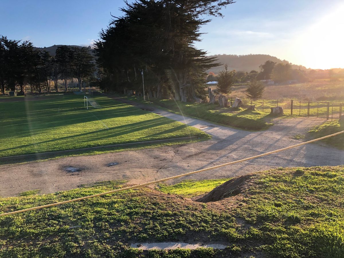 Looking down to the basket from Hole 12's tee pad.