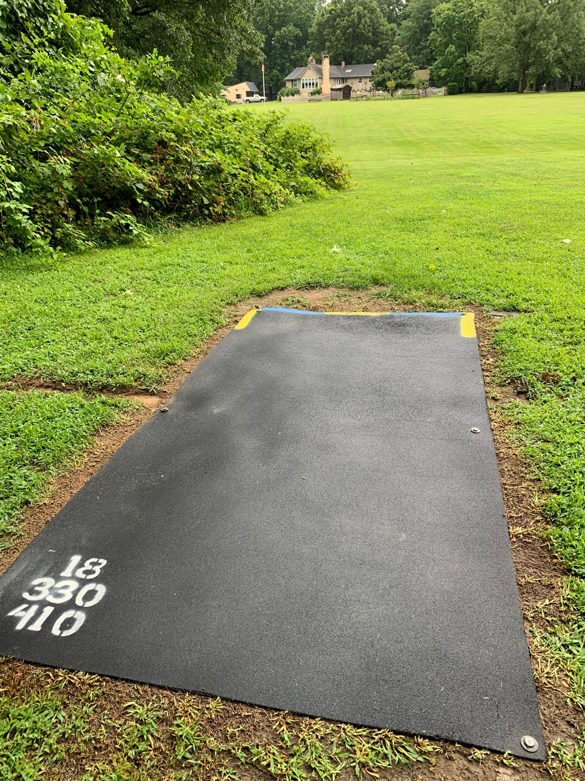 Hole 18 blue and gold tee. Blue plays as a left to right 330’. Gold is left of the flagpole 415.’