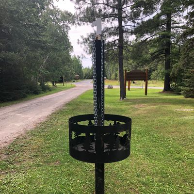 Each basket has a couple chains just hanging there, but the hole number is on top. Narrow baskets.