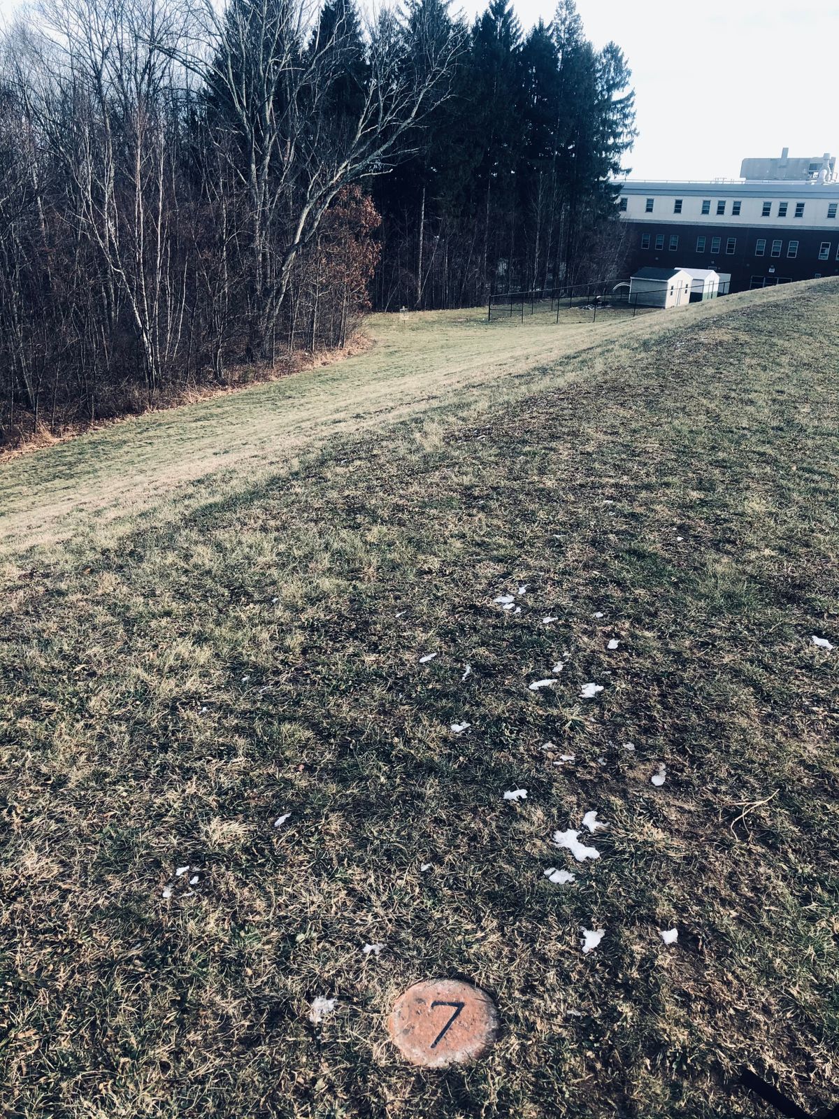 A tricky Hyzer line.   Stay low or you'll end up in the woods.
