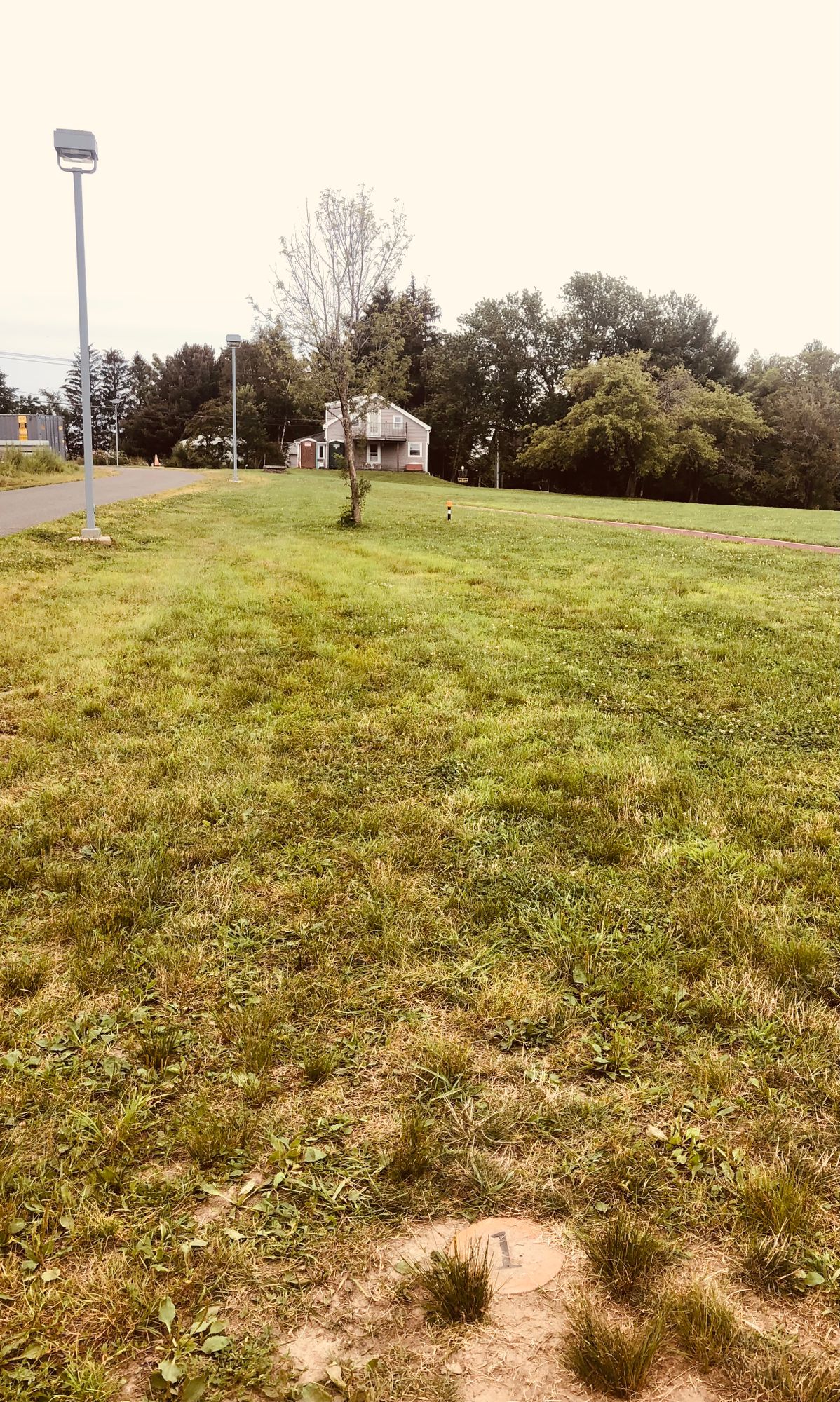 OLD TEE: Hole 1 actual tee when its not muddy or hidden by a town trailer.