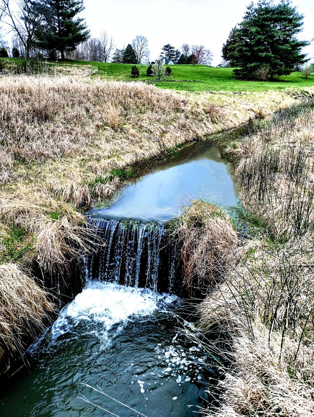 little waterfall next to hole 1 tee