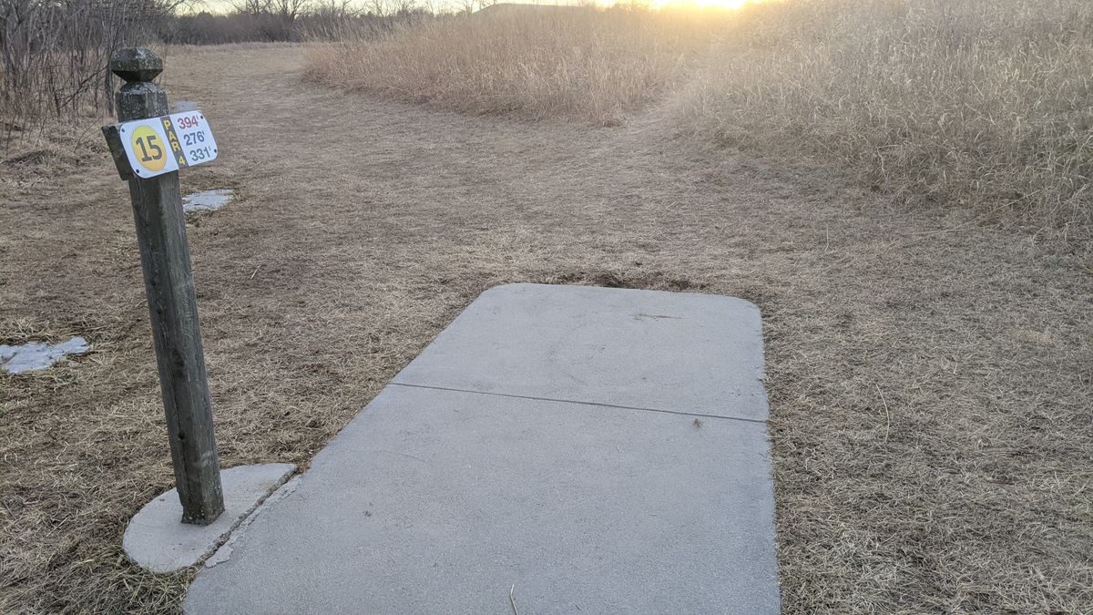 Tee #15 basket is over the hill straight towards sunset