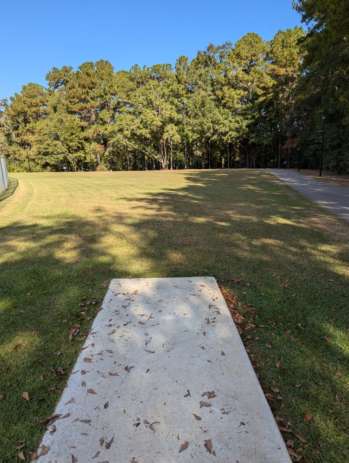 Hole 17 straight ahead across the walking path in the woods