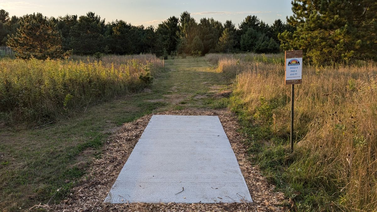 Tee of 9. Time to let 'er rip. This 420ish foot fairway with generous landing areas is begging for most players to throw a stable driver. The local pros can likely hit circle one from the tee but the rest of us mortals will be playing for position.

There will be a Mando on the left edge of the fairway at the tree line to ensure people don't get cute and throw over the gardens.
