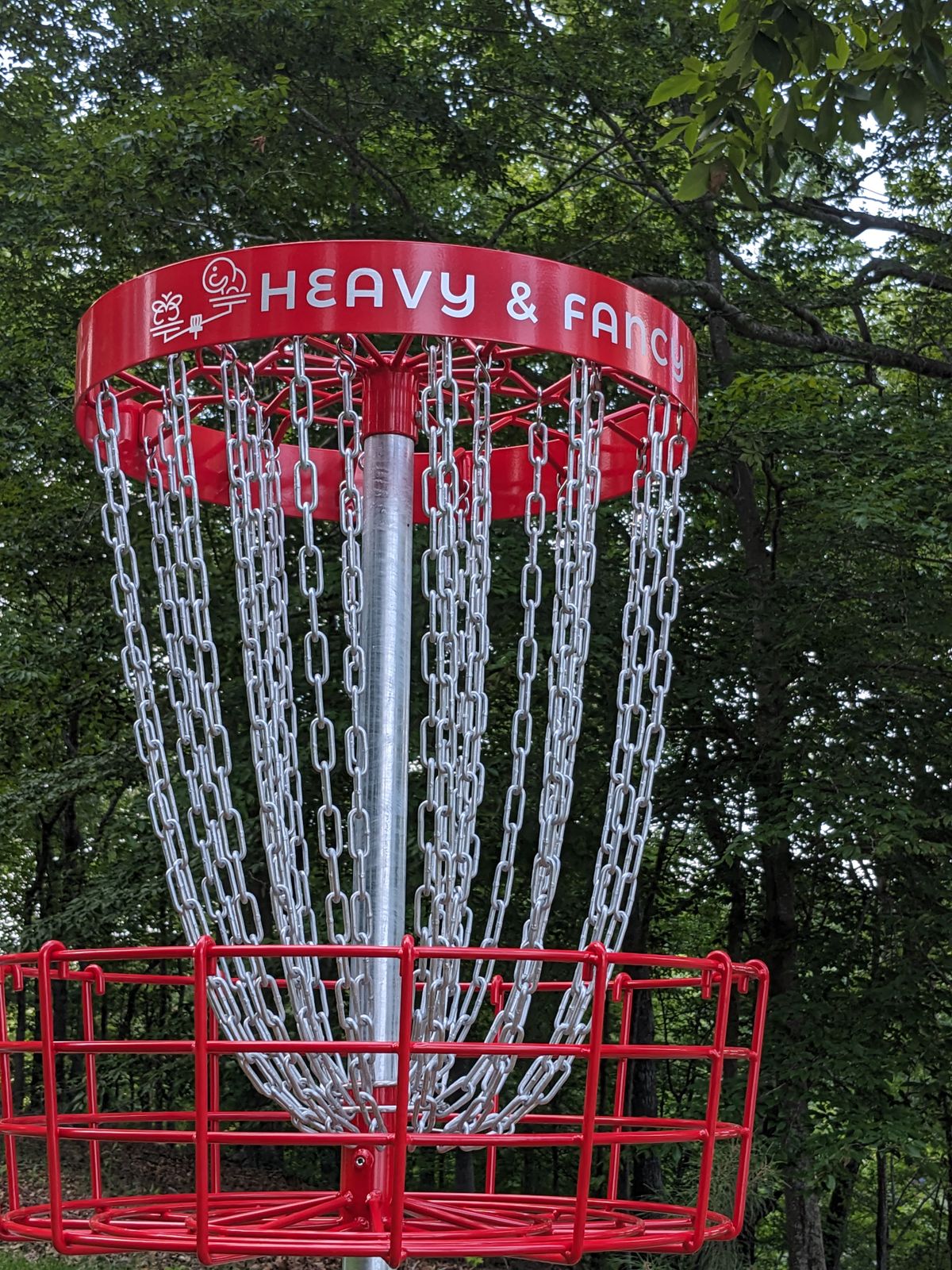 Heavy and Fancy Disc Golf course custom red baskets