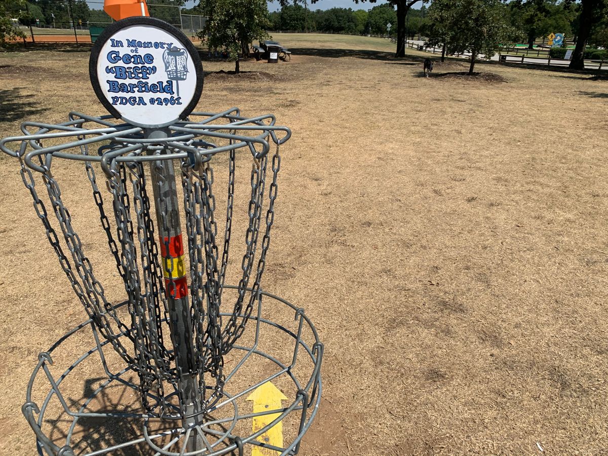 Hole 14 Basket. Arrow on the floor directs you to 15. Back over the bridge, right of 8’s basket.