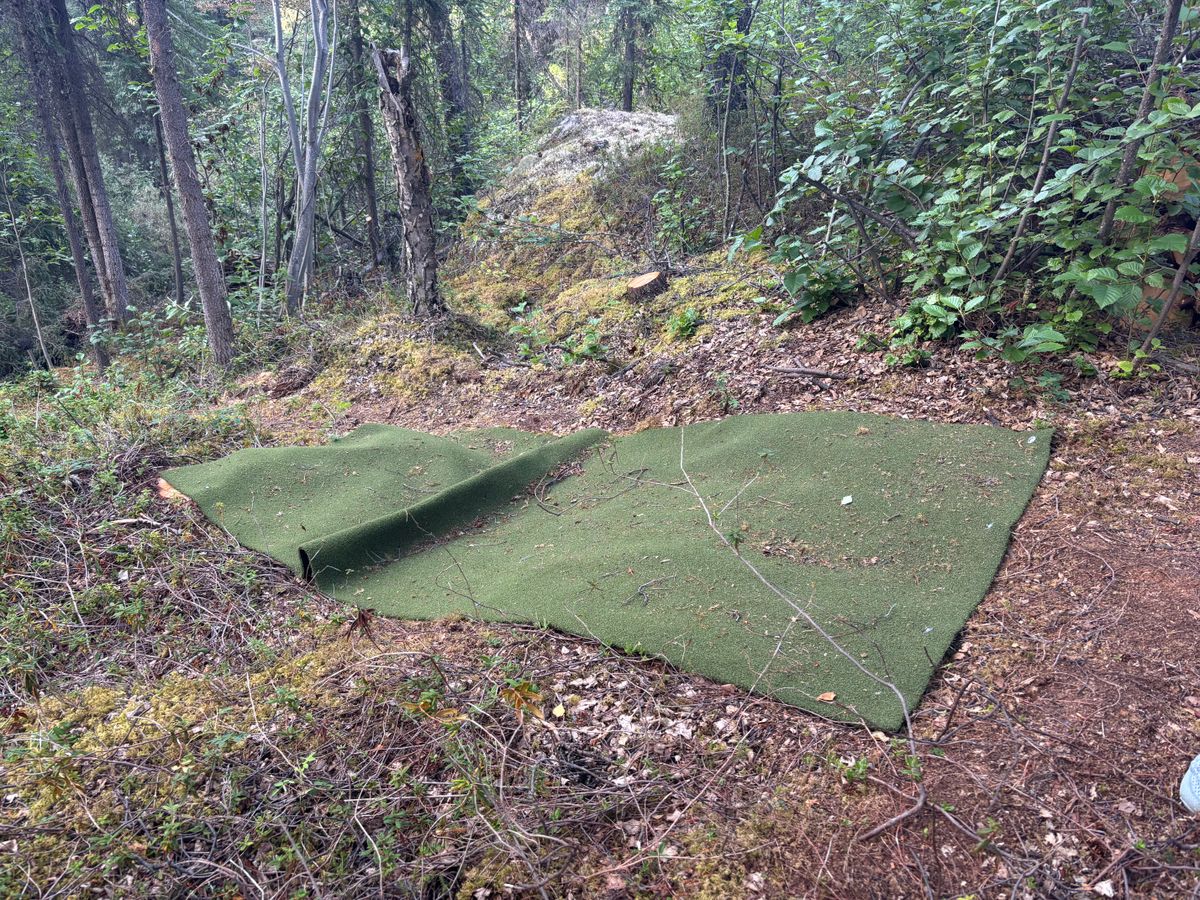 Some tees consisted of outdoor carpet pinned to the uneven earth.