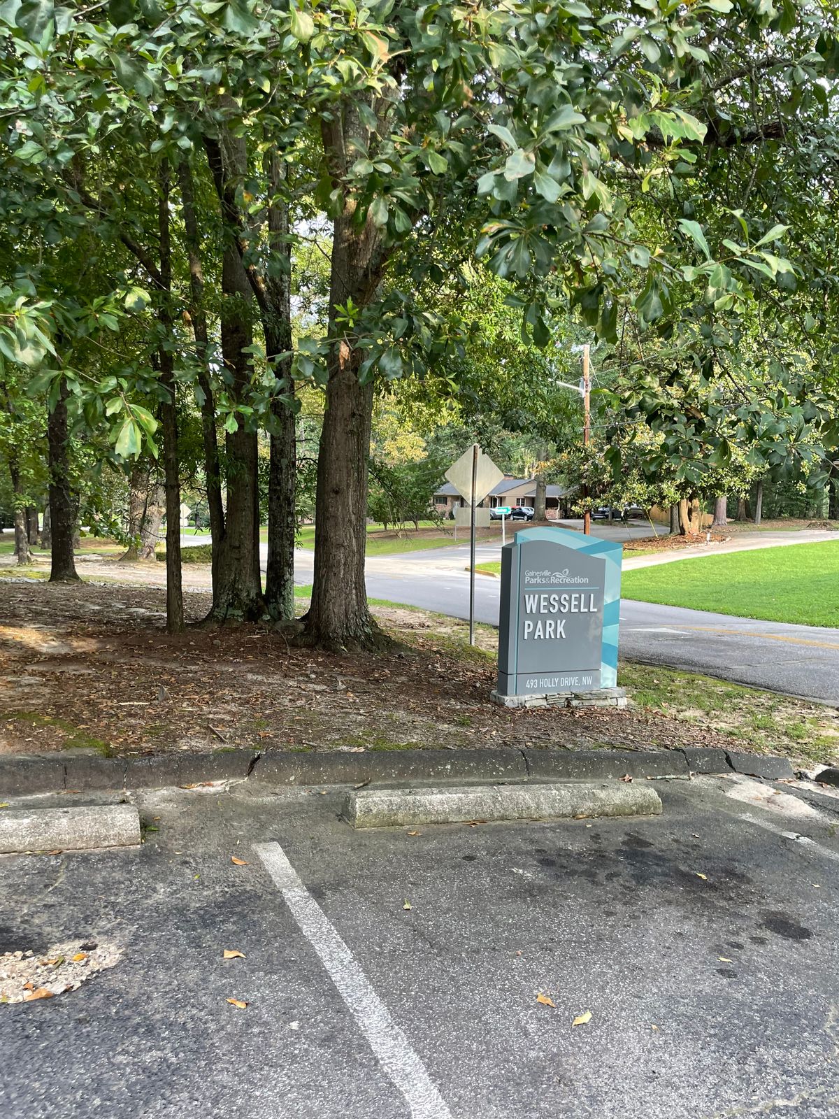 Small parking lot. Hole one is to the left of this sign