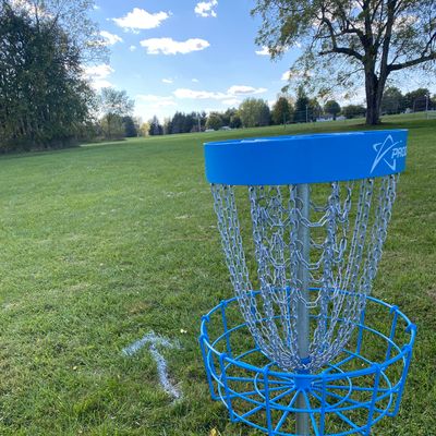Directional arrow painted on grass after first basket