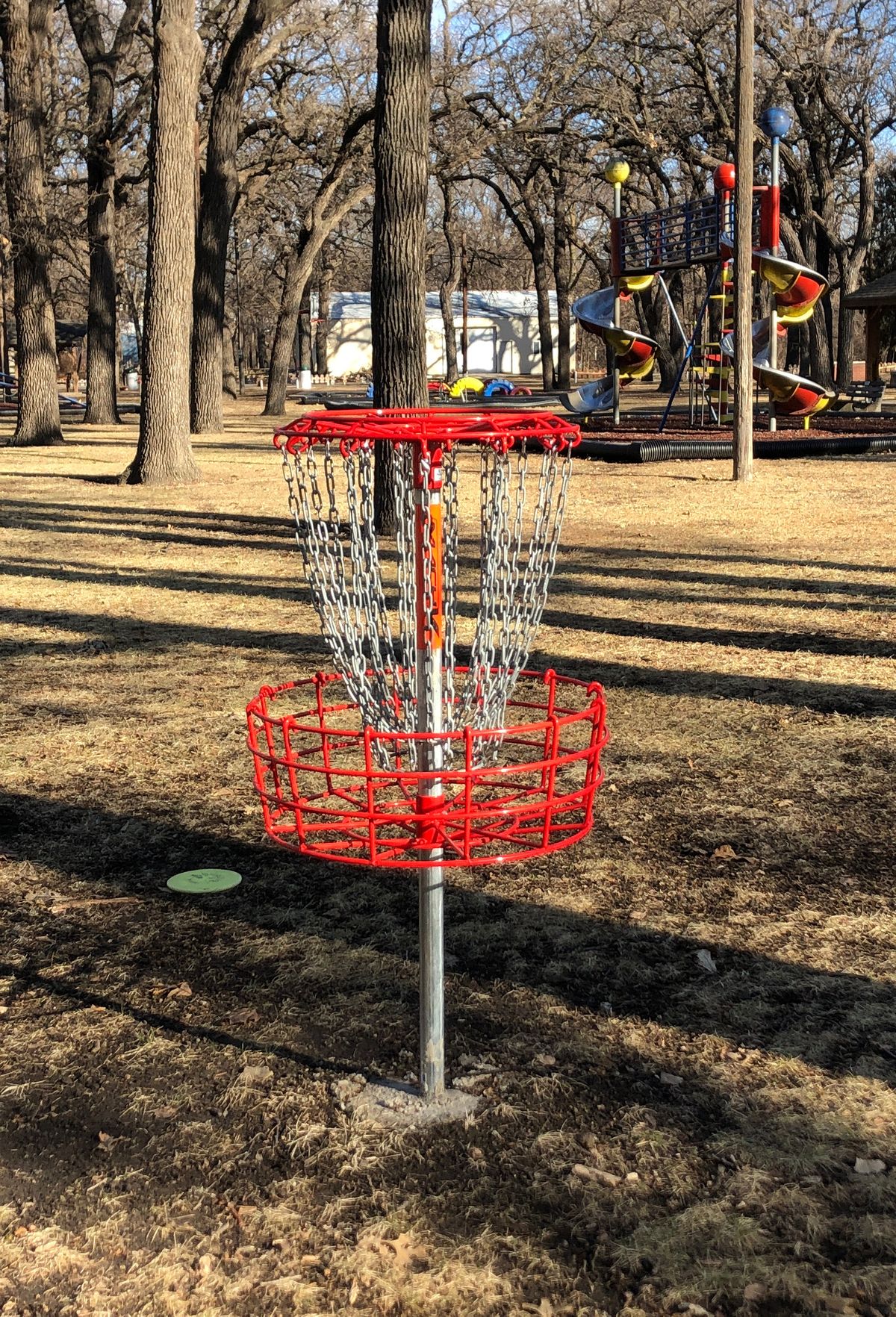 #6 basket. Course is around the outside of a playground. Any throw landing in the playground is OB.