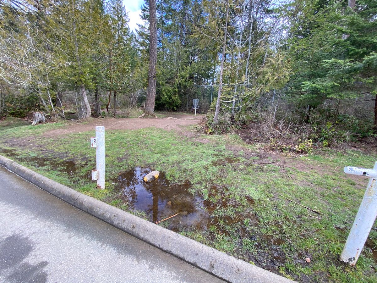 Hole 8 roadway OB.  Lefty hook.