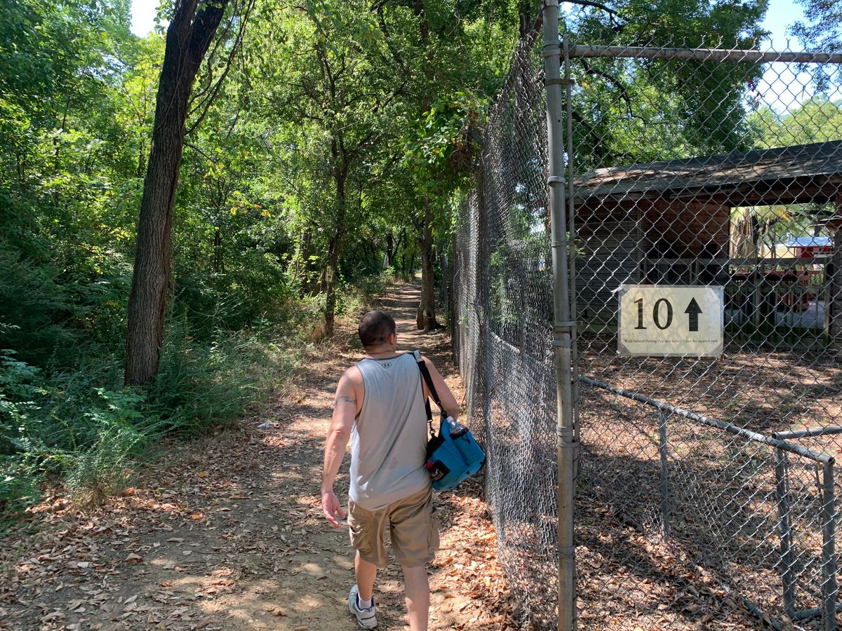 Walk to hole 10. Behind the petting zoo cages about 100 yards from 9 basket to 10 tee pad.