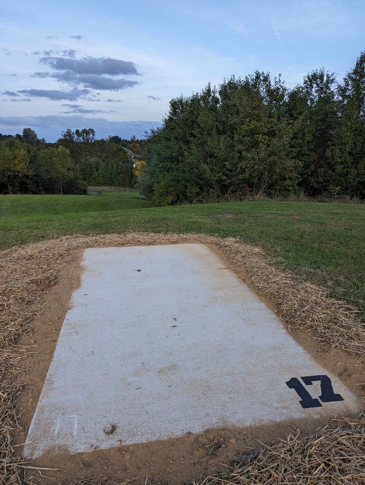 New hole 17: Tee pad is the near the old basket location for old 17. Throw down the hill