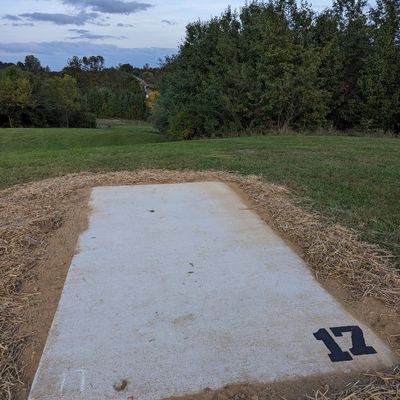 New hole 17: Tee pad is the near the old basket location for old 17. Throw down the hill