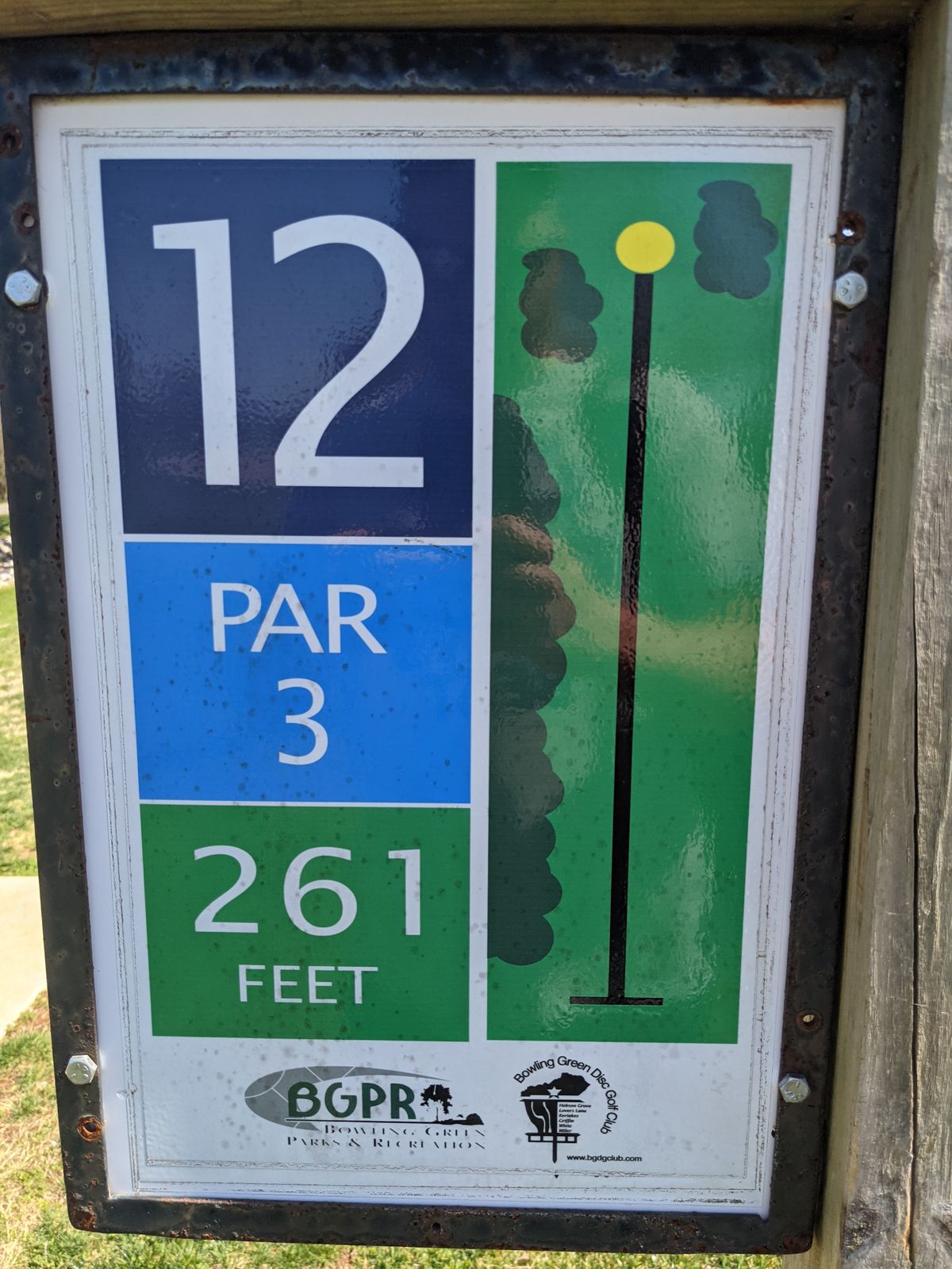 Hole 12 is a scoreable Par 3 that is out of the woods.  Don't take the hole for granted though.  A guardian on the left creates a low ceiling and slender trees on the right tempt players to try and go around or over trouble.