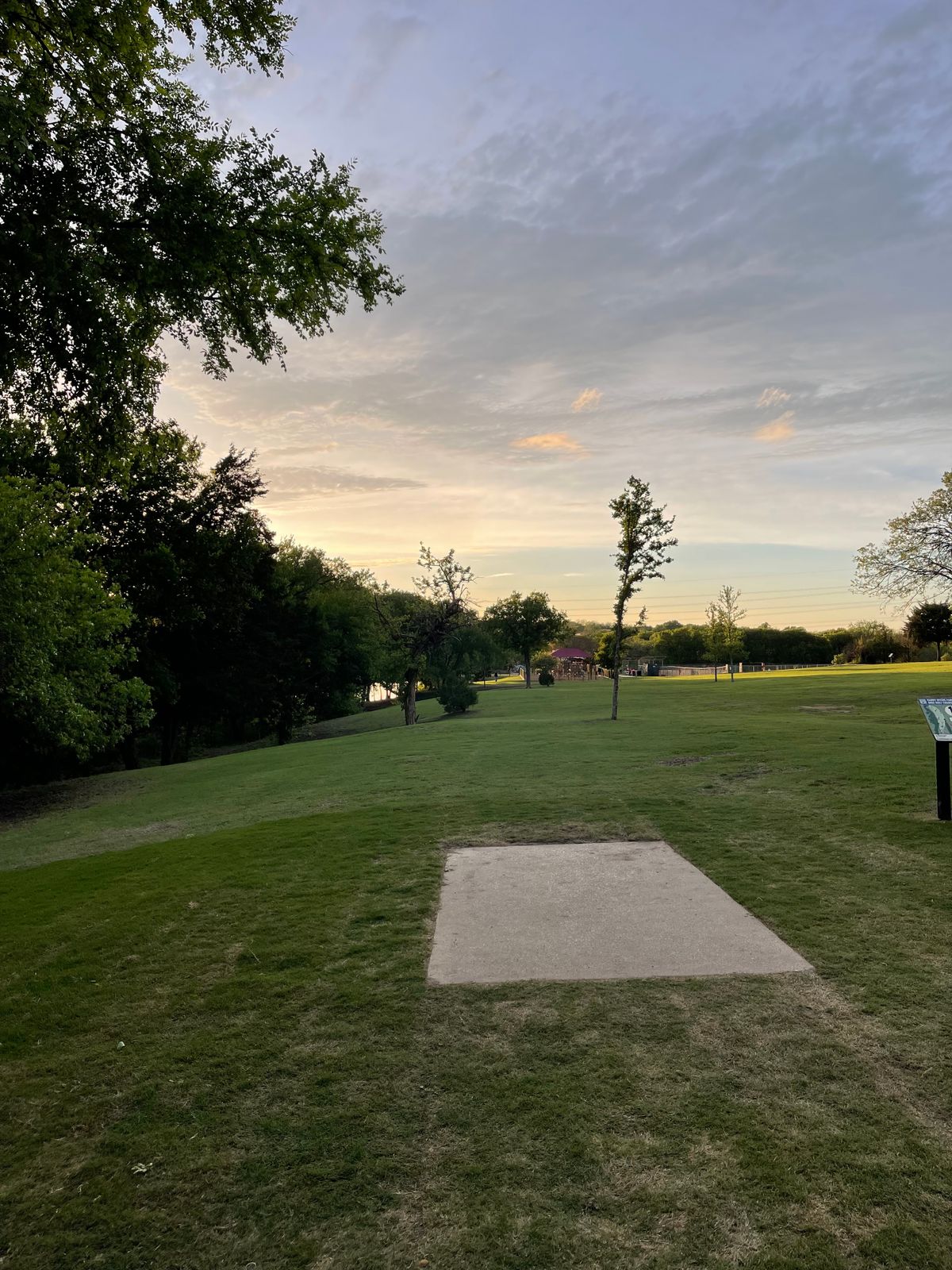 Red tee pad for hole 1 with new turf