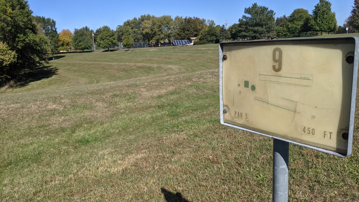 #9 Tee board.  Basket is past, and left of the solar panels, up by the Basketball court.