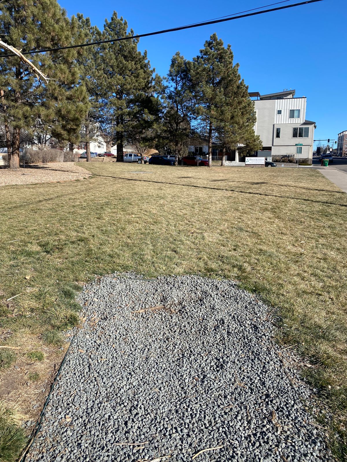 Hole 3. Basket is in the trees just before the parked cars. The basket on the left is for hole 4