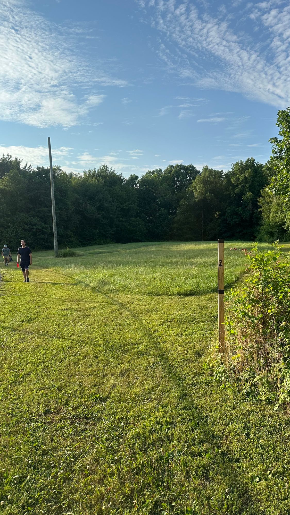 Hole 2 Teepad

Aim for the first opening on the left
Basket is hooked left inside opening