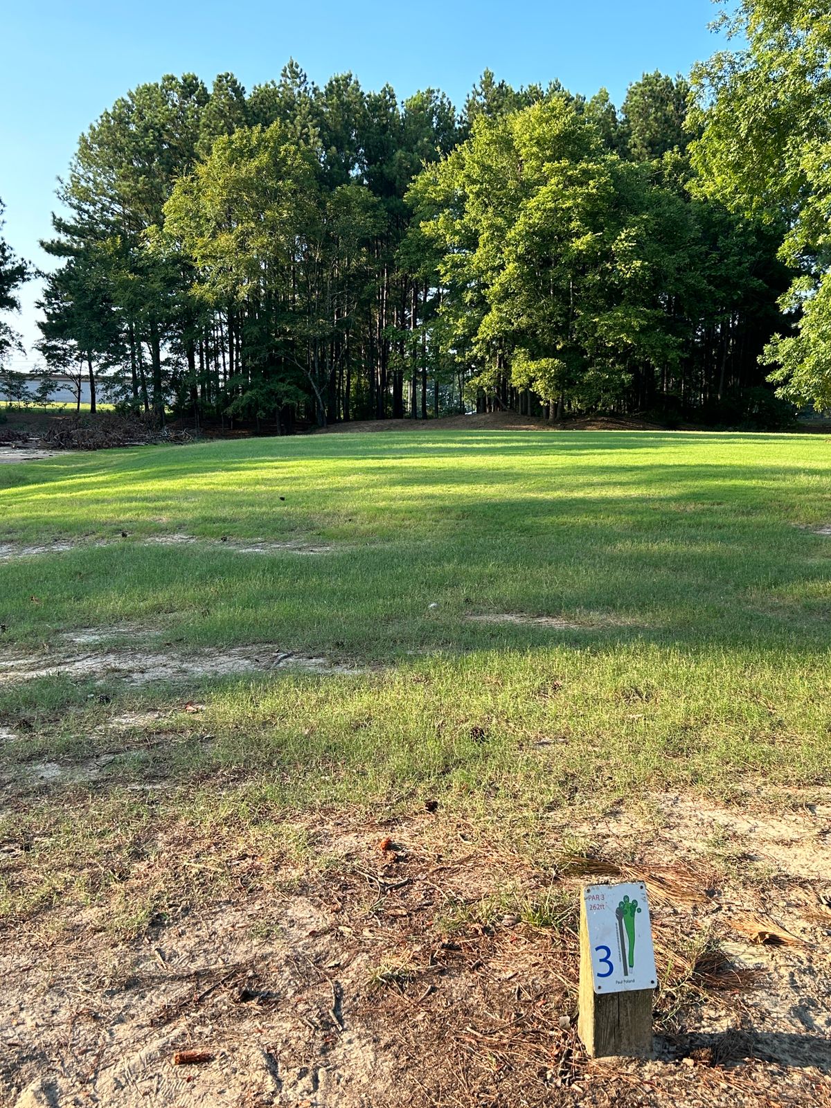 Hole 3 is tucked away in the trees. No clear concrete tee