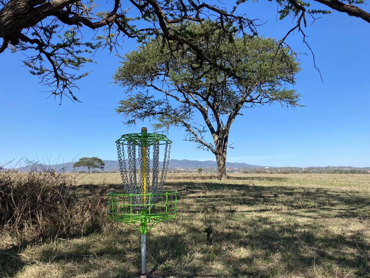 Hole 12 (400’ / 122m, par 4) with Ngong Hills in the distance