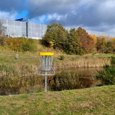The basket with the pond behind it, on hole 12, serves as a nice backstop.