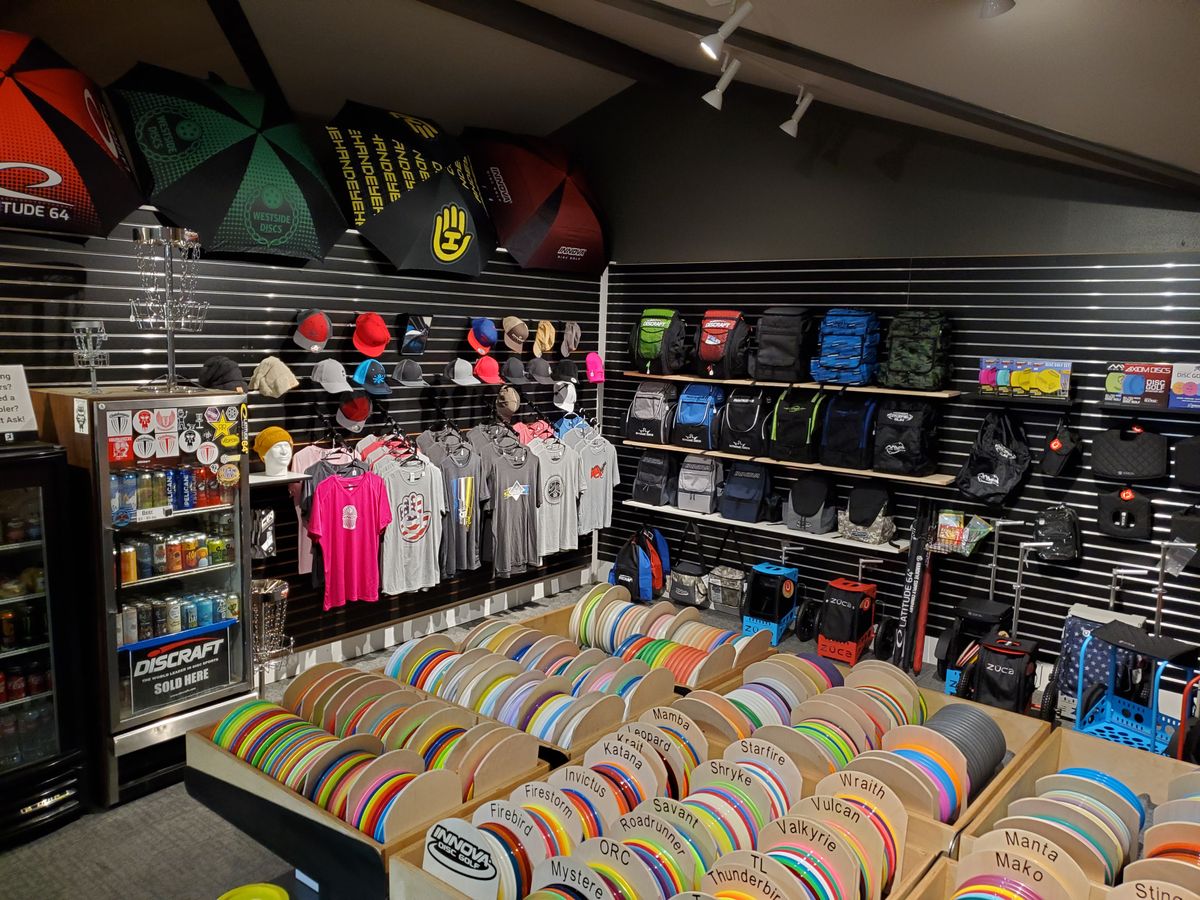 Nice selection of discs, bags, shirts, hats, and gear.