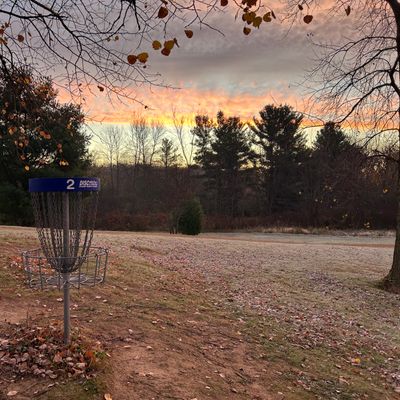 Hole 2 basket with sunrise and frost