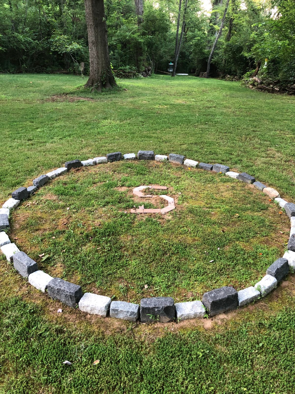 Land in or on Sarsparilla’s  Circle and you get a free throw out from anywhere inside the stones.