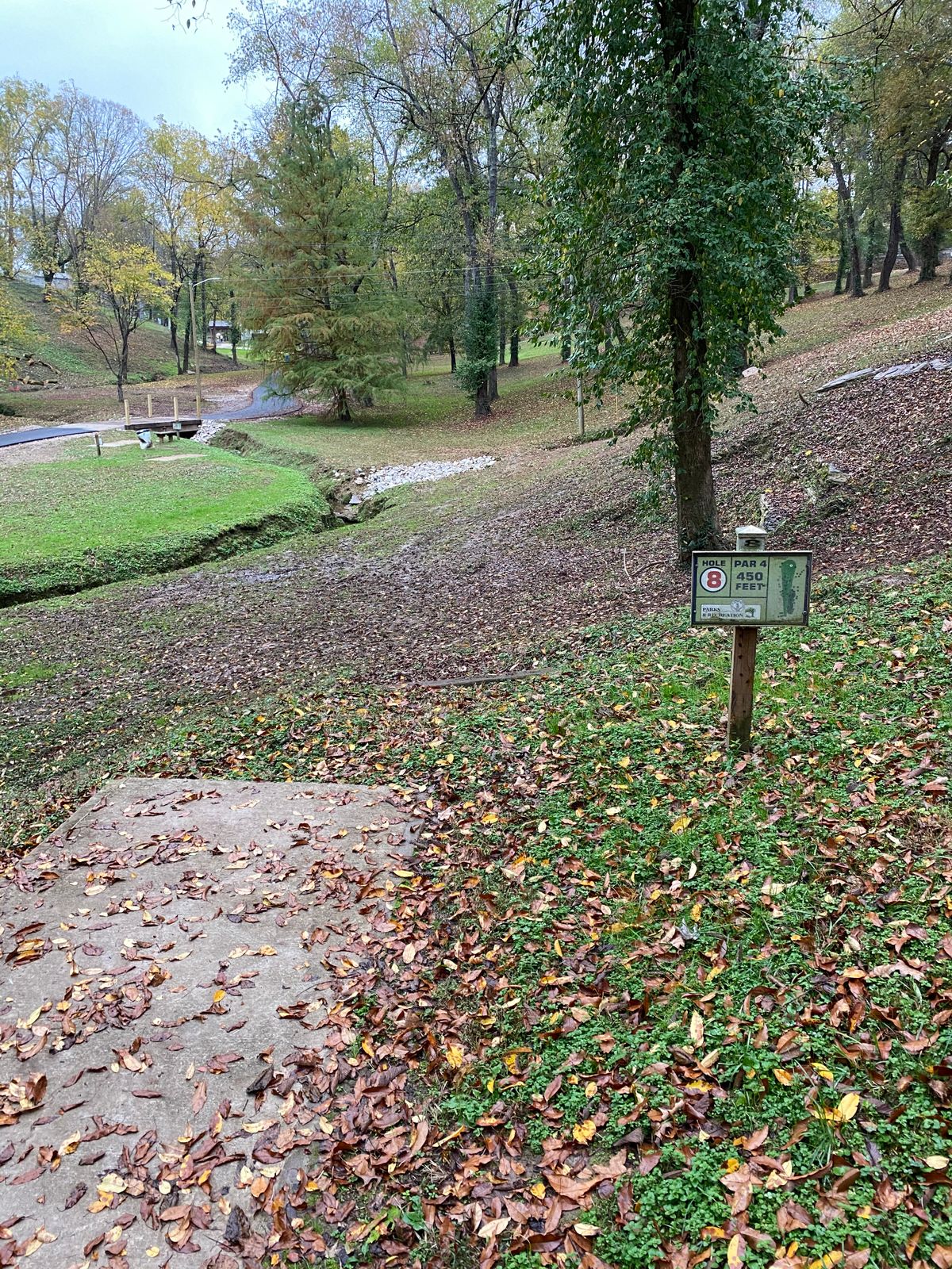 Hole 8. Par 4 with dog leg right up the hill. Not the basket directly in front of the teepad.