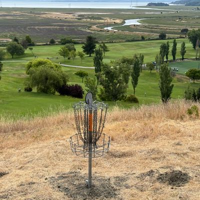 Hole #8 basket, overlooking the golf course & the bay…