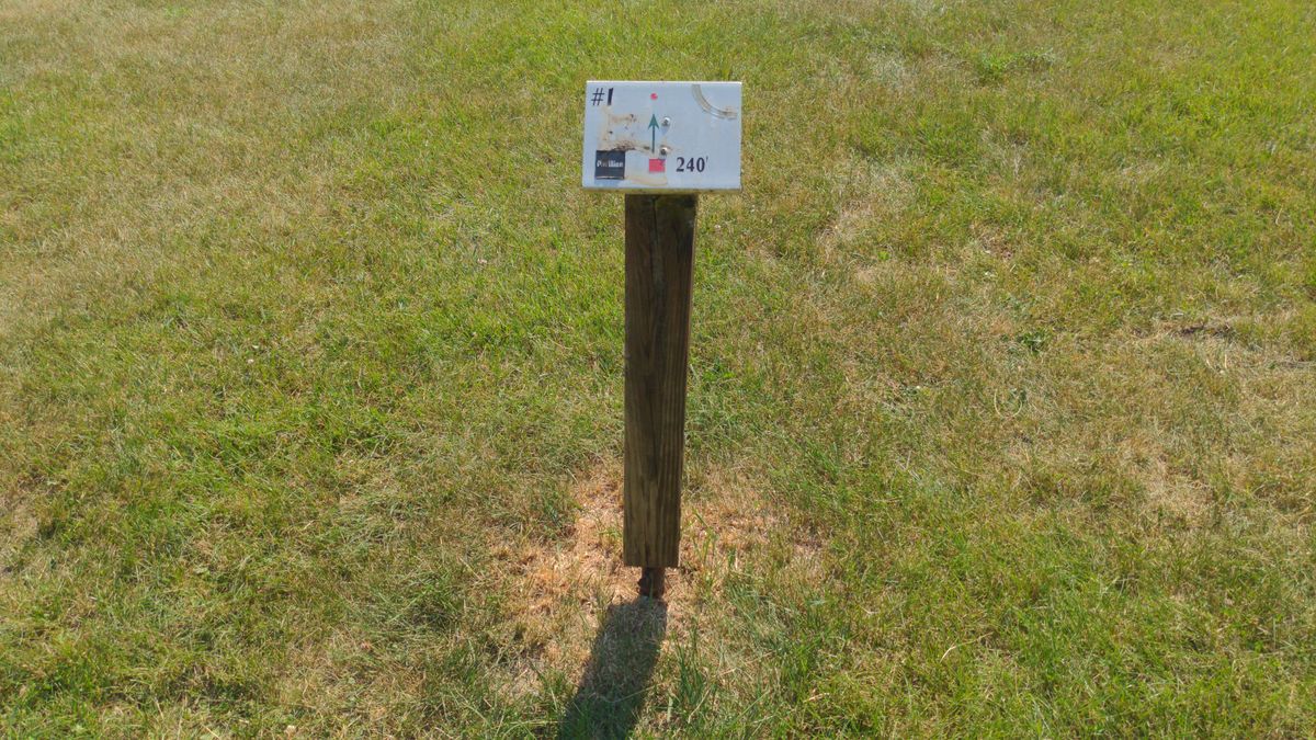 No tee pads, but the tee locations are marked with posts.