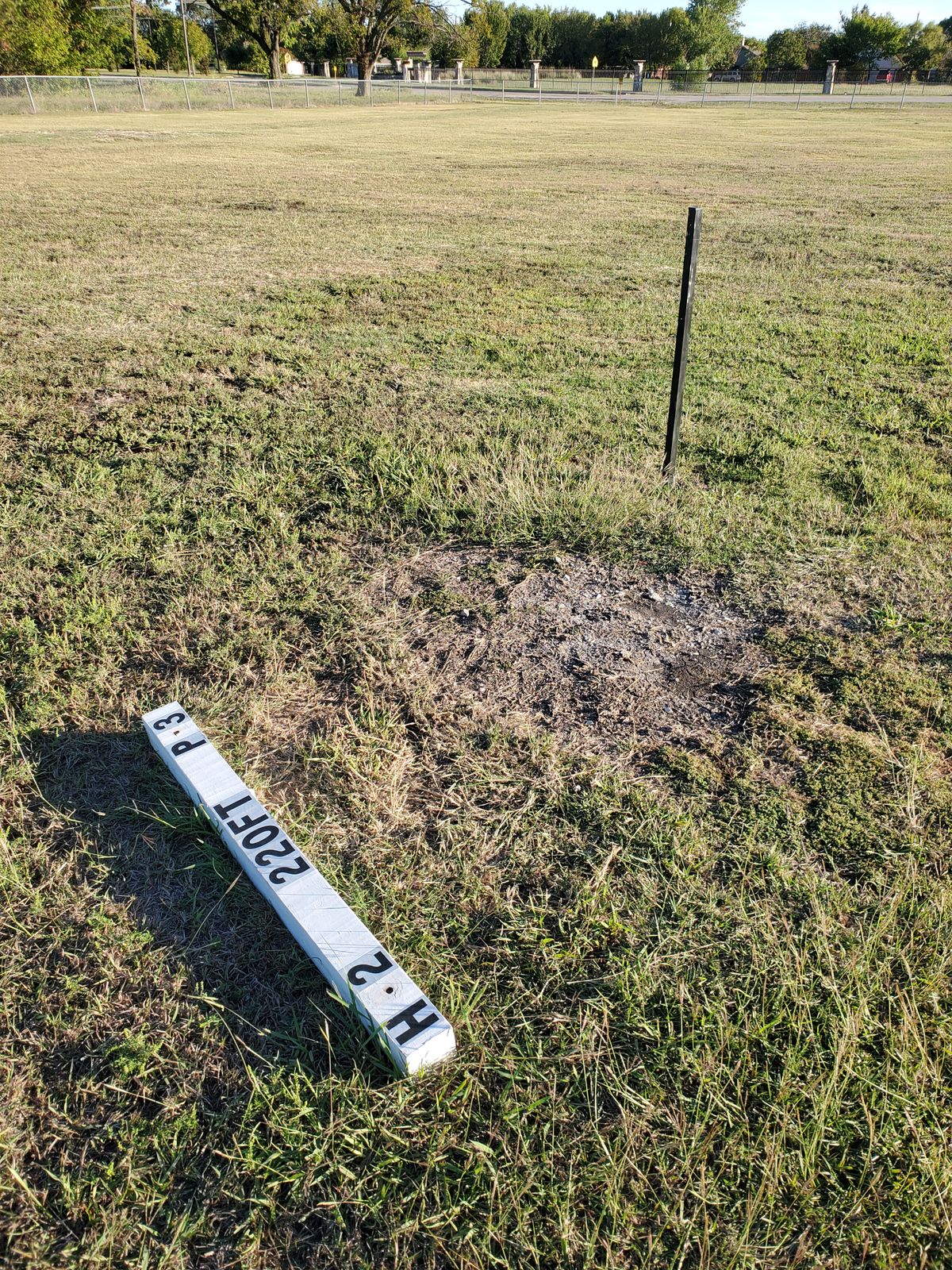 Current tee pads are the white 3x3s but they've got posts up for the upcoming signage