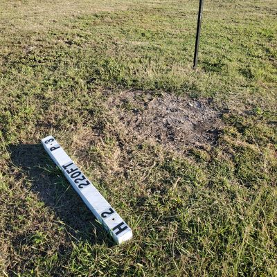 Current tee pads are the white 3x3s but they've got posts up for the upcoming signage