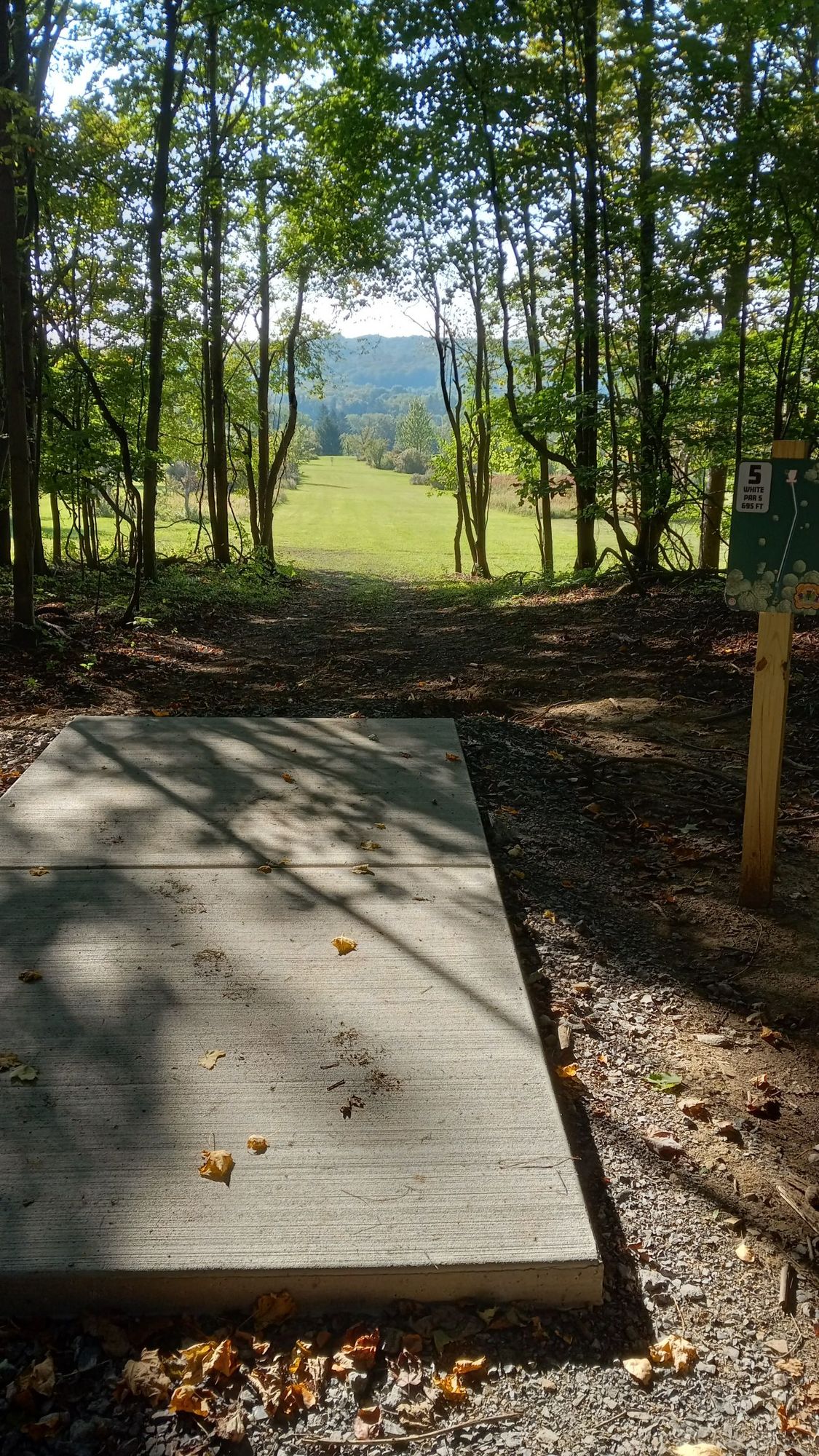 Hole 15 new white tee pad and sign