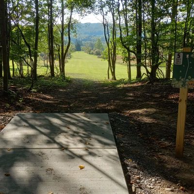 Hole 15 new white tee pad and sign