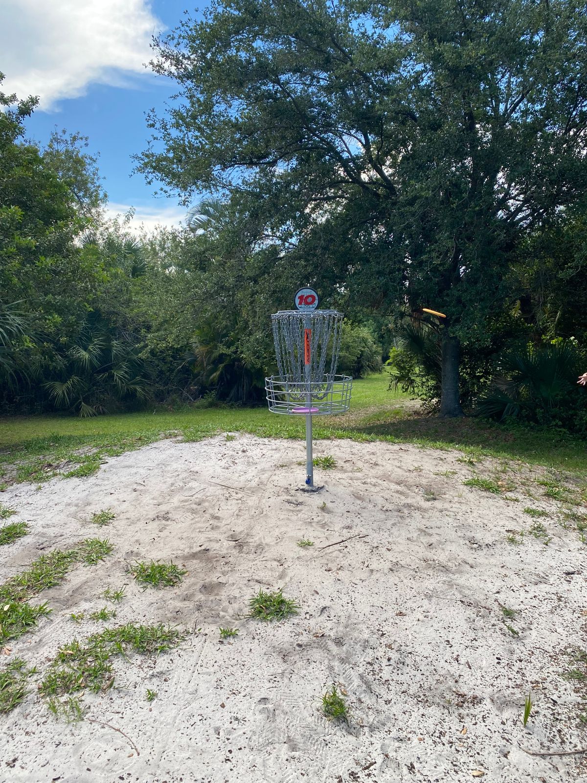Hole 10 basket straight and up to the left in sand/gravel area