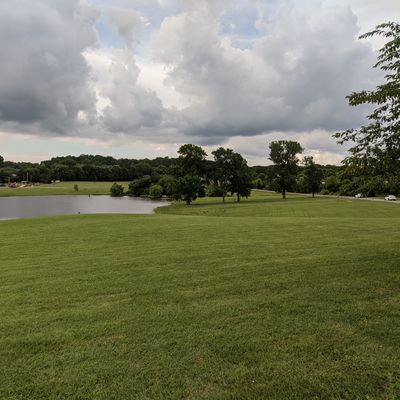 Practice basket, and first fairway along the edge of the pond.