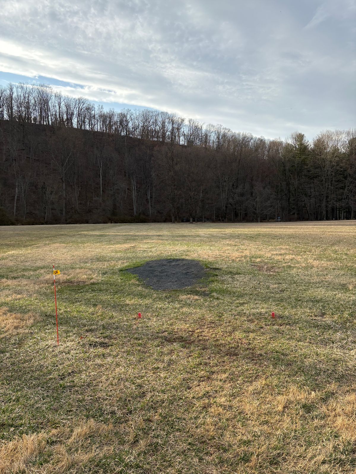 Proposed hole 12 is directly behind the gravel pad