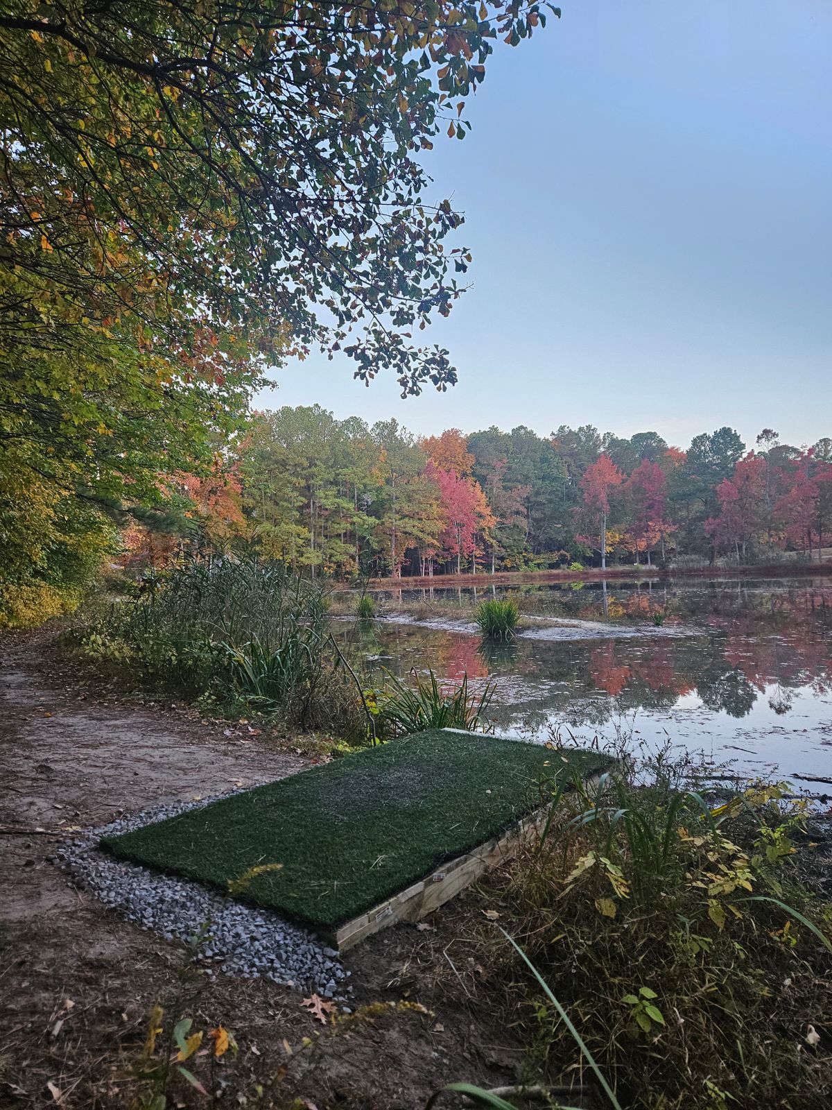 Hole 9 tee pad with the pond in the background