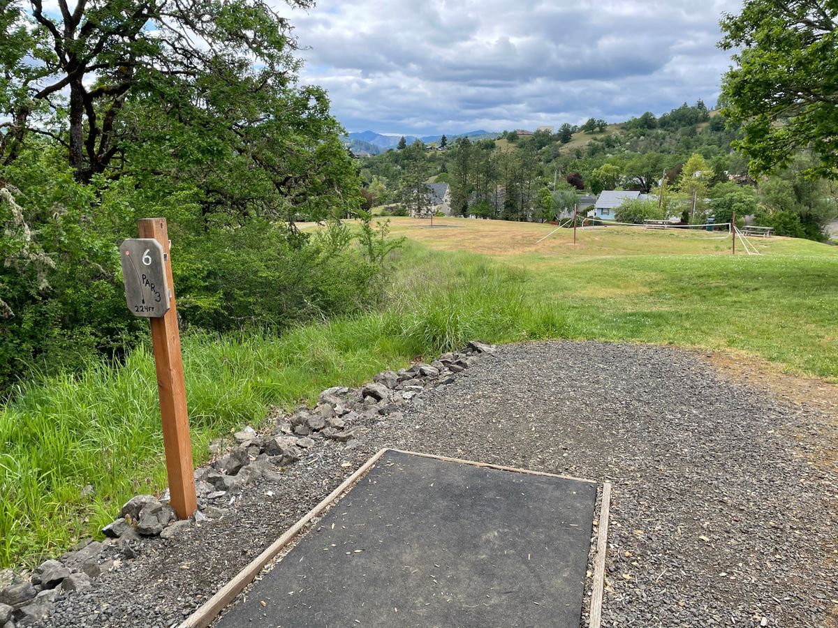 Hole 6 tee pad looking out towards the basket.