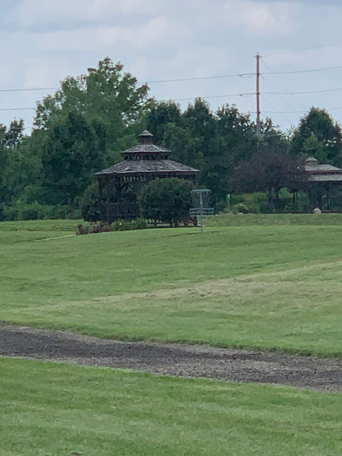 View of number 2 from teen pad behind basket is a lake