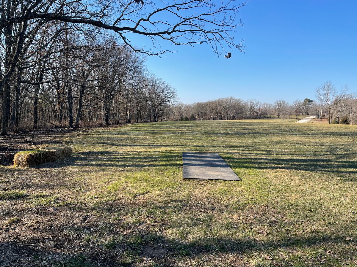 Hole 1 tee pad par 4 dog legs left at 400’ to basket 555’