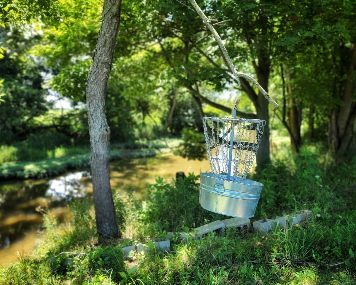 One of several hanging baskets and photo shows creek which runs thru most of the course