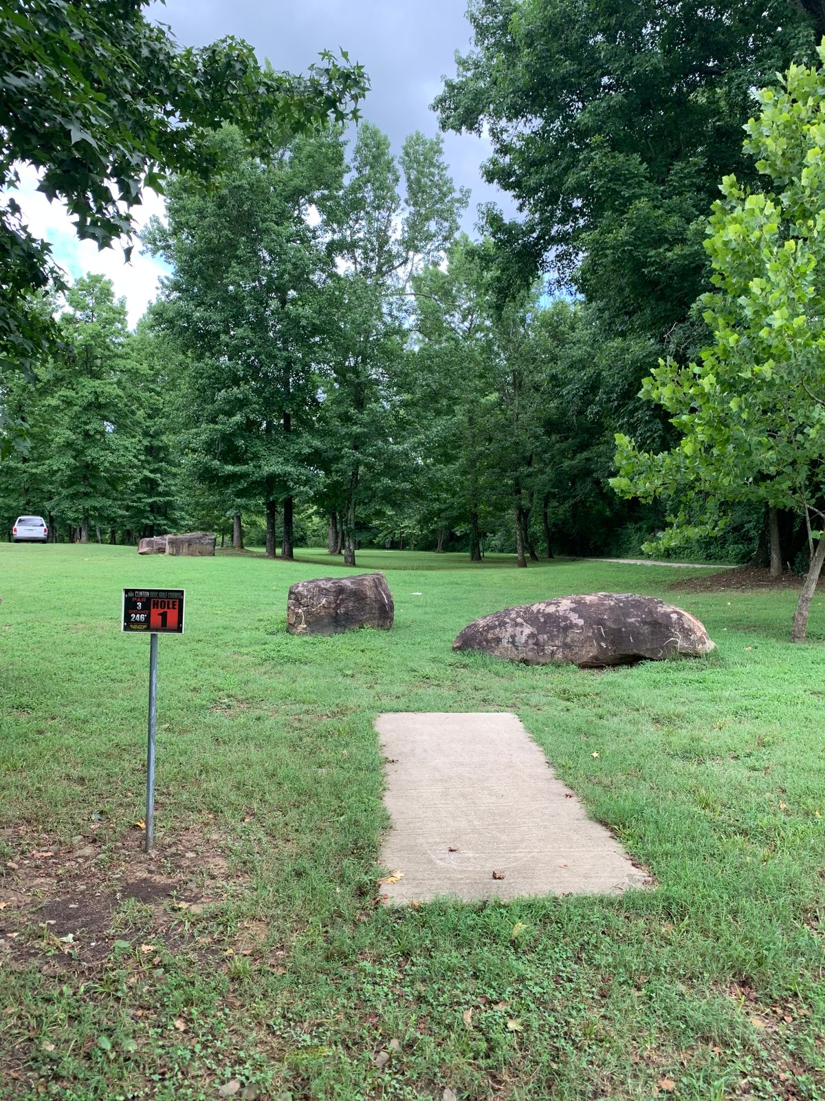 Hole 1. Same basket for 10 different tee pad is off to the left of 1 tee
