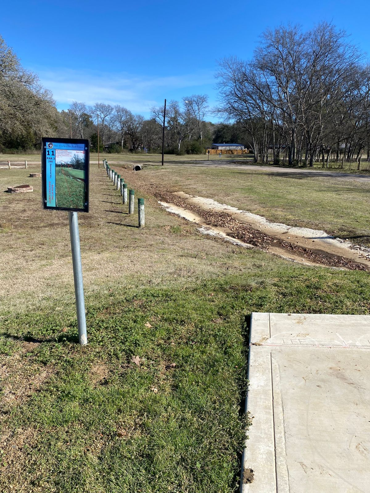 Hole 11, 295ft, OB left of fence posts before the far road, all road surfaces and beyond to the righ