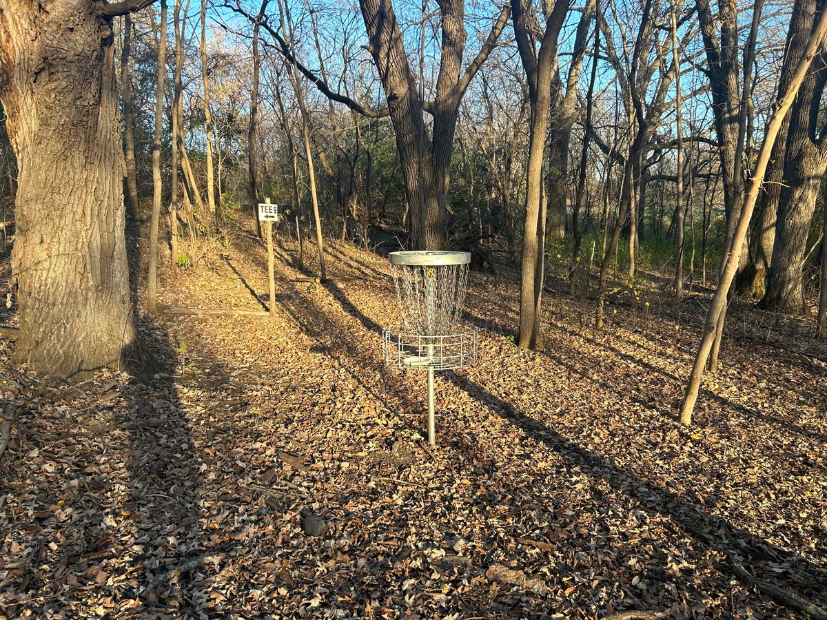 Hole 8 basket, also showing signage to next hole